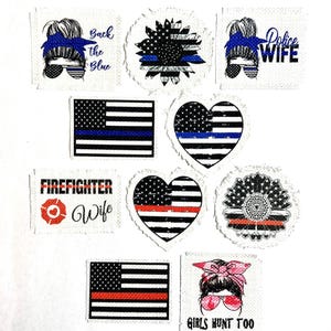May include: Nine iron-on patches with various designs, including a sunflower, a heart, an American flag, and a woman's face. The patches feature the text "Back the Blue", "Police Wife", "Firefighter Wife", and "Girls Hunt Too".