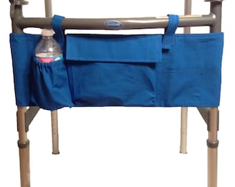May include: A blue fabric walker bag with a water bottle holder and two pockets. The bag is attached to a silver walker with wheels.