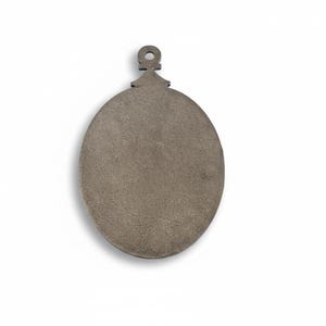 May include: A flat, oval-shaped, metallic gray ornament with a loop at the top for hanging. The ornament has a textured surface and is likely made of metal. The design is simple and minimalist, suitable for holiday or seasonal decor.