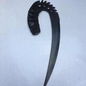 May include: A black, curved, serrated blade with a black leather wrapped handle.