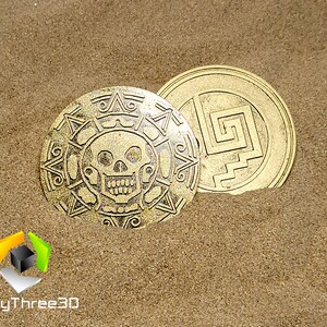 May include: Two gold-colored metal coins with intricate designs. One coin features a skull and crossbones, while the other has a geometric pattern.