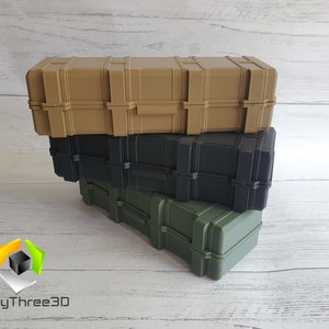 May include: Three stackable plastic storage cases in tan, black, and green. The cases have a textured surface and a latching lid.
