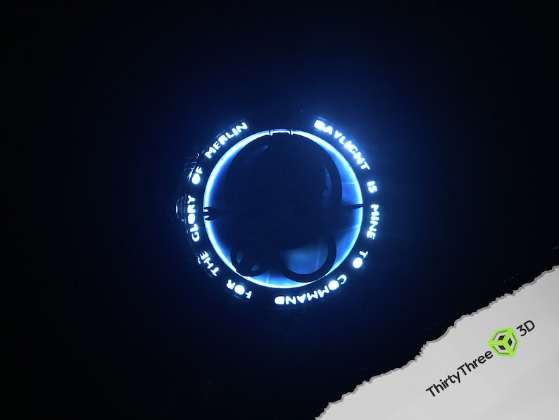 May include: A blue glowing ring with the text "FOR THE GLORY OF MERLIN TO COMMAND DAYLIGHT IS MINE" around the outside.