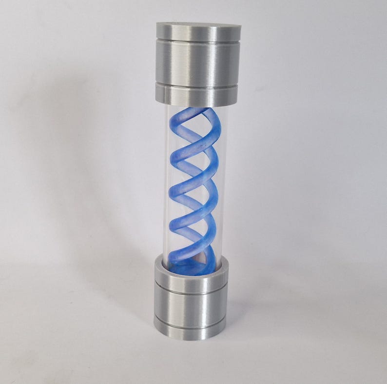 May include: A cylindrical container with a clear tube and metallic silver caps at the top and bottom. Inside the tube is a blue, double-helix shaped structure. The container is standing upright against a white background.
