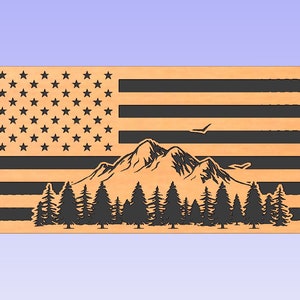 May include: A wooden cutout of an American flag with a mountain range and pine trees in front of it. The flag is in black and white, and the mountain range and trees are in black.