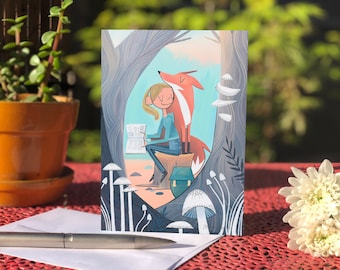 May include: A greeting card featuring a girl sitting on a tree stump with a fox beside her. The girl is reading a book and the fox is looking up at the sky. The background is a forest scene with mushrooms and trees.