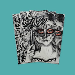 May include: A black and white drawing of a woman wearing a mask with orange eyes. The mask is ornate and has a lot of detail. The woman's hair is long and flowing. The drawing is on a stack of paper.