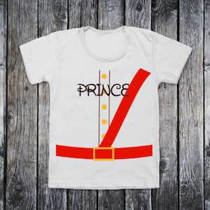 May include: White t-shirt with a red sash and belt, and the word "PRINCE" in a stylized font.