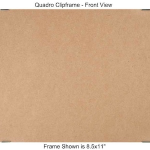 May include: A brown cardboard picture frame with a black metal clip on each corner. The frame is 8.5 inches by 11 inches.