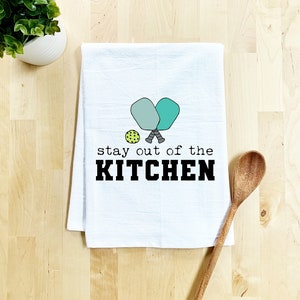 a kitchen towel that says stay out of the kitchen