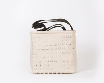 Beige perforated crossbody bag