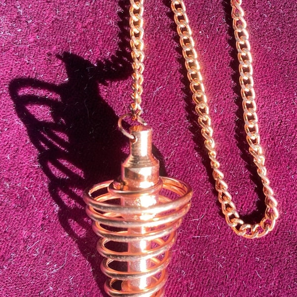 Copper-Closeout Copper-Beautiful handmade wire swirled around solid core center pointer about 9" long includes 6" chain Great Balance