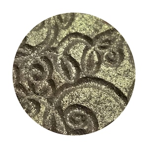 Arabian Nights. A Bright White Gold with green shift and gold reflects. Duochrome shifting sparkle highlighter