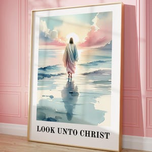 May include: Framed art print featuring a watercolor depiction of a figure walking on water towards a sunset. The artwork is in a gold frame and includes the text "LOOK UNTO CHRIST" at the bottom. The color palette includes blues, pinks, and yellows.