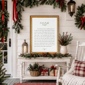 May include: A framed vertical wall art print featuring the lyrics to the Christmas carol O Holy Night in black text on a white background, accented with a small green sprig illustration and a decorative line at the bottom of the printed text.