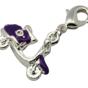 May include: A silver charm with a purple scooter design. The charm has a lobster clasp.