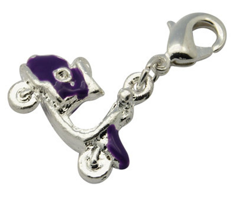 May include: A silver charm with a purple scooter design. The charm has a lobster clasp.