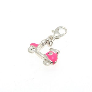 May include: A silver charm in the shape of a pink scooter with white polka dots. The charm has a silver lobster clasp.
