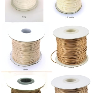 May include: Five spools of waxed cotton cord in different colours: ivory, off white, cream, goldenrod, and dark goldenrod.