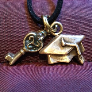 Grad B215 Graduation motar board (cap) pure golden bronze, handmade, and a decorative key (key to future) on Black suede  cord