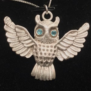 CF080 Pure silver owl with blue eyes that are manmade gems, high silver content .999