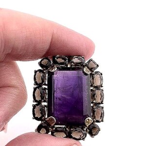 Vintage Amethyst Stone with smokey quartz pendent - Large Stone in center of gold plating surrounded by Chocolate colored gemstones.