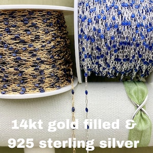 May include: Spools of 14kt gold filled and 925 sterling silver chain with blue bead accents. The gold chain is on the left, the silver chain is on the right. The text "14kt gold filled & 925 sterling silver" is at the bottom.