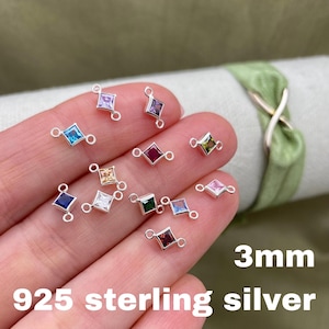 May include: A close-up of 925 sterling silver connectors with 3mm square-shaped gemstones in various colors. The connectors have two loops on each side.