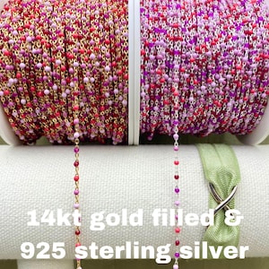 May include: Two spools of colorful bead chain, one in 14kt gold filled and one in 925 sterling silver. The beads are pink, red, and purple.