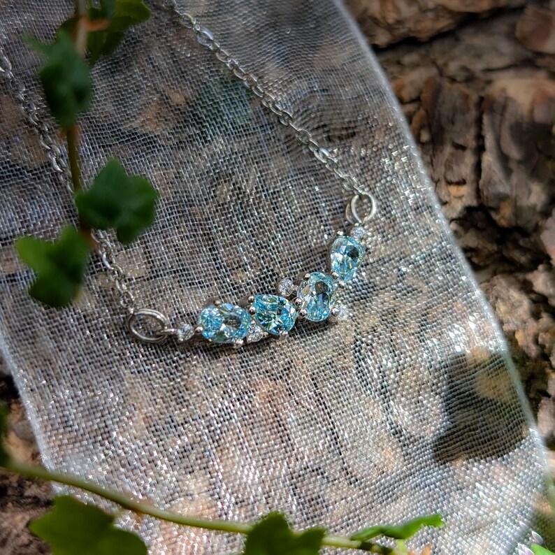 aquamarine legacy four stone cluster necklace, custom, light blue, teardrop and oval, silver, yellow gold