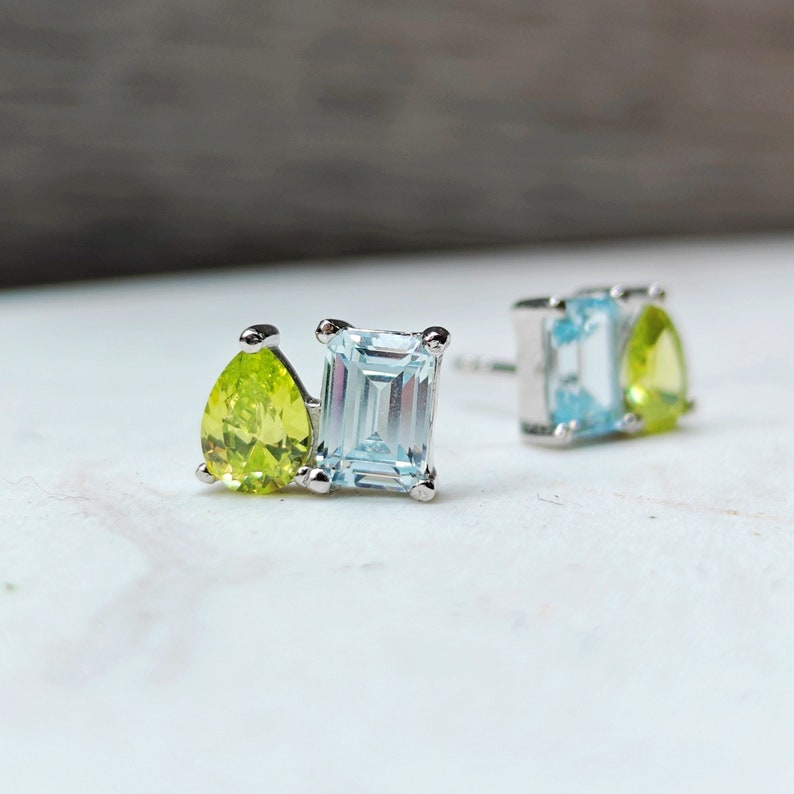 earring studs, aurora, toi et moi, custom, two stone, pushback earrings, emerald cut and teardrop, genuine gemstone red garnet, purple amethyst, light blue aquamarine, clear quartz, opal, green emerald, multicolor alexandrite, rainbow topaz, pink ruby, light green peridot, blue sapphire, pink tourmaline, orange citrine, blue-purple tanzanite, sunstone, smokey quartz, onyx, moss agate, rutilated quartz, in silver yellow gold rose gold 14k solid gold
