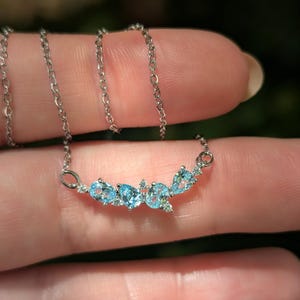 aquamarine legacy four stone cluster necklace, custom, light blue, teardrop and oval, silver, yellow gold