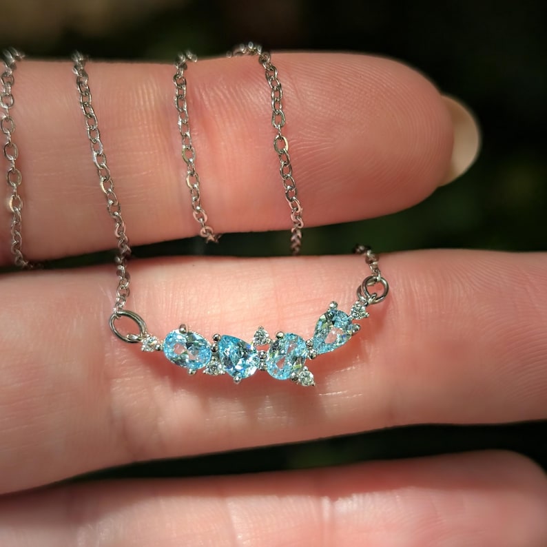 aquamarine legacy four stone cluster necklace, custom, light blue, teardrop and oval, silver, yellow gold