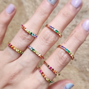 ring, eternity band, stacking ring, pink ruby, red and orange garnet, yellow citrine, light green peridot, green emerald, blue topaz, purple amethyst, round stones, silver, yellow gold, rose gold