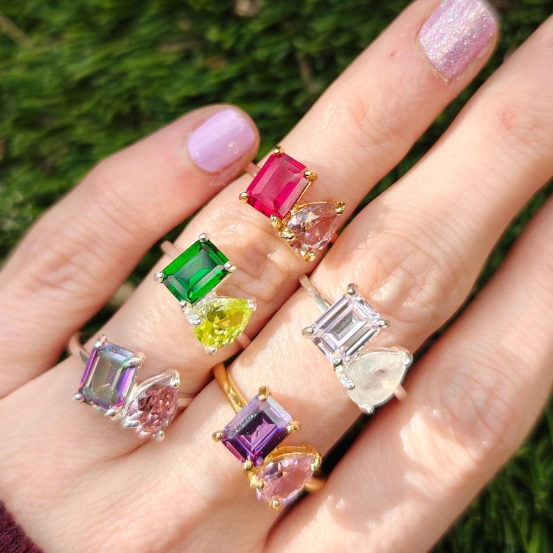 ring, aurora, toi et moi, custom, two stone, emerald cut and teardrop, genuine gemstone red garnet, purple amethyst, light blue aquamarine, clear quartz, opal, green emerald, multicolor alexandrite, rainbow topaz, pink ruby, light green peridot, blue sapphire, pink tourmaline, orange citrine, blue-purple tanzanite, sunstone, smokey quartz, onyx, moss agate, rutilated quartz, in silver yellow gold rose gold 14k solid gold