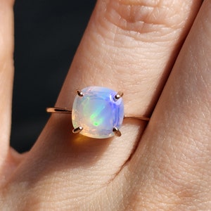 ring, rainbow iridescent fire welo opal, square stone, silver, yellow gold, rose gold