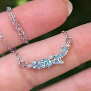 aquamarine legacy four stone cluster necklace, custom, light blue, teardrop and oval, silver, yellow gold