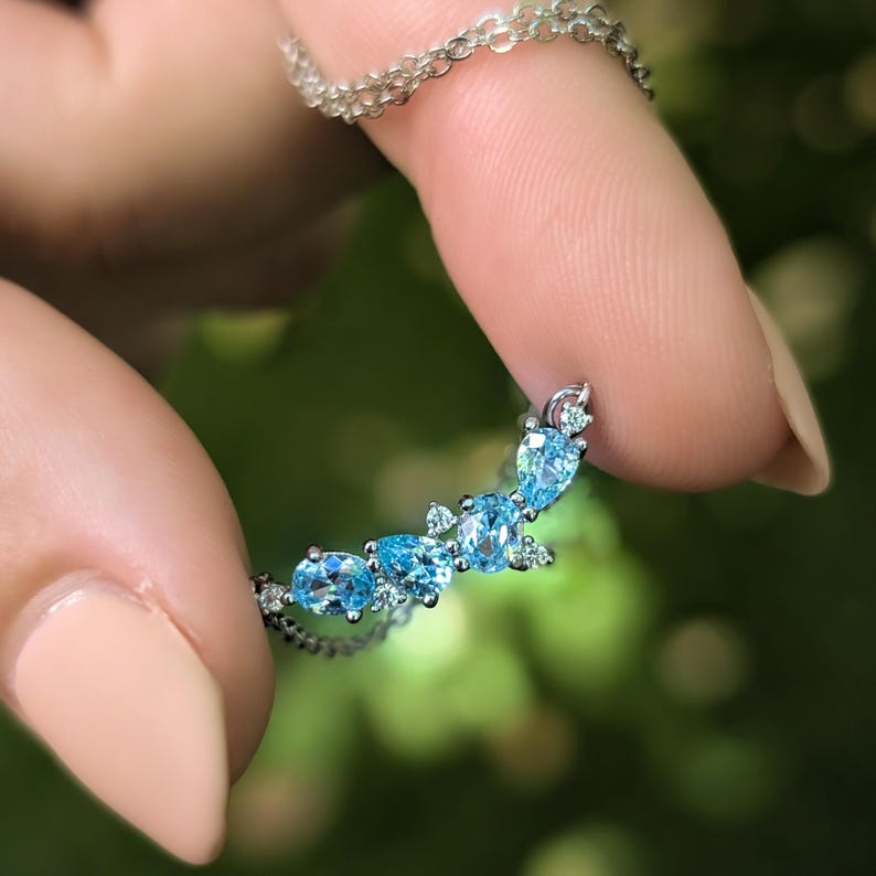 aquamarine legacy four stone cluster necklace, custom, light blue, teardrop and oval, silver, yellow gold