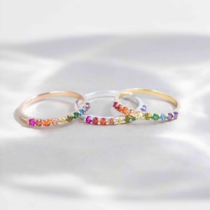 ring, eternity band, stacking ring, pink ruby, red and orange garnet, yellow citrine, light green peridot, green emerald, blue topaz, purple amethyst, round stones, silver, yellow gold, rose gold