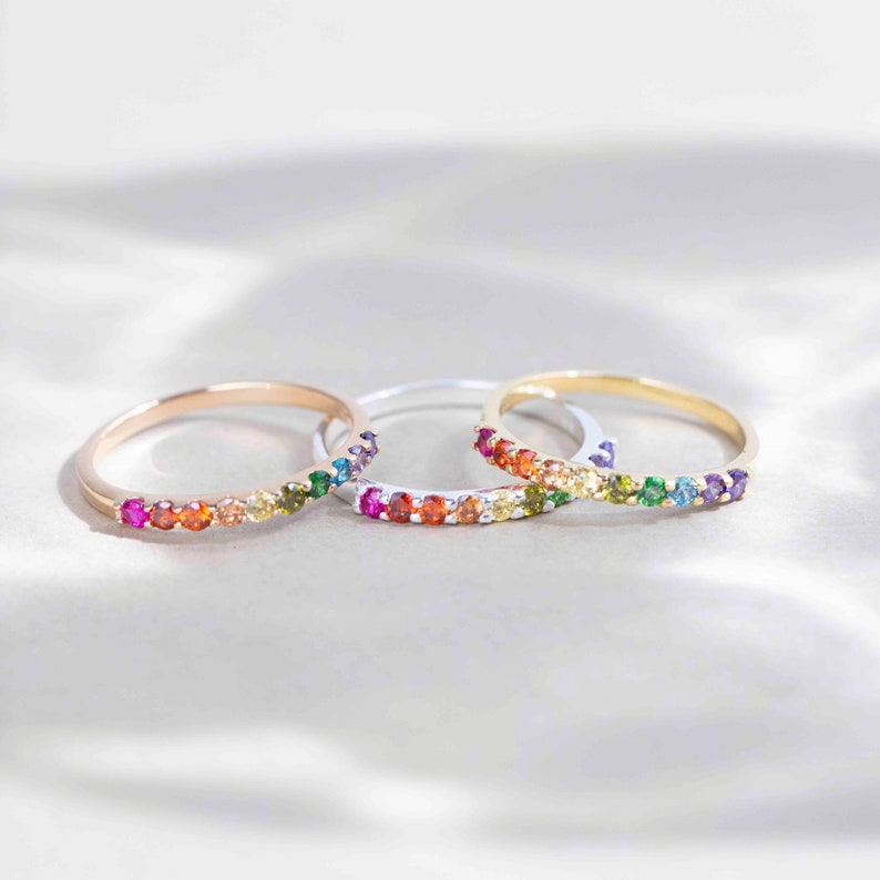 ring, eternity band, stacking ring, pink ruby, red and orange garnet, yellow citrine, light green peridot, green emerald, blue topaz, purple amethyst, round stones, silver, yellow gold, rose gold