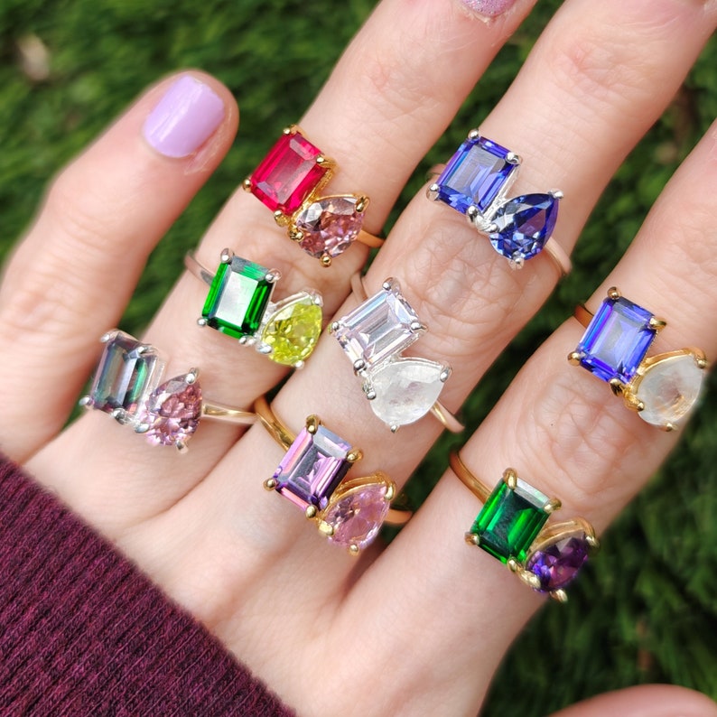 ring, aurora, toi et moi, custom, two stone, emerald cut and teardrop, genuine gemstone red garnet, purple amethyst, light blue aquamarine, clear quartz, opal, green emerald, multicolor alexandrite, rainbow topaz, pink ruby, light green peridot, blue sapphire, pink tourmaline, orange citrine, blue-purple tanzanite, sunstone, smokey quartz, onyx, moss agate, rutilated quartz, in silver yellow gold rose gold 14k solid gold