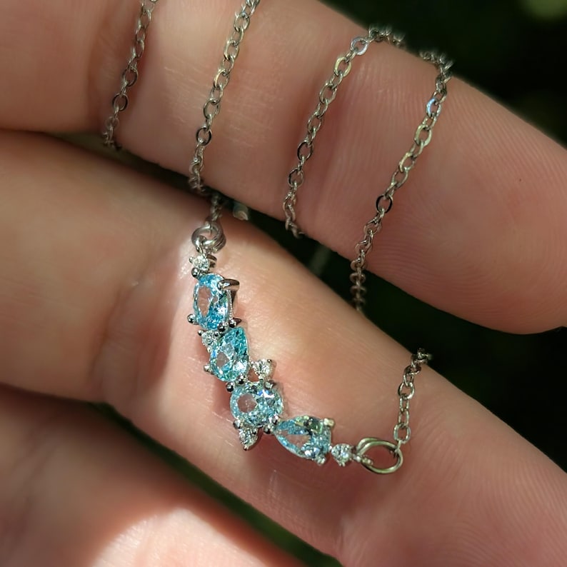 aquamarine legacy four stone cluster necklace, custom, light blue, teardrop and oval, silver, yellow gold