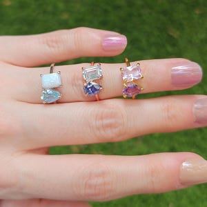 ring, aurora, toi et moi, custom, two stone, emerald cut and teardrop, genuine gemstone red garnet, purple amethyst, light blue aquamarine, clear quartz, opal, green emerald, multicolor alexandrite, rainbow topaz, pink ruby, light green peridot, blue sapphire, pink tourmaline, orange citrine, blue-purple tanzanite, sunstone, smokey quartz, onyx, moss agate, rutilated quartz, in silver yellow gold rose gold 14k solid gold