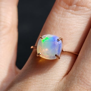 ring, rainbow iridescent fire welo opal, square stone, silver, yellow gold, rose gold
