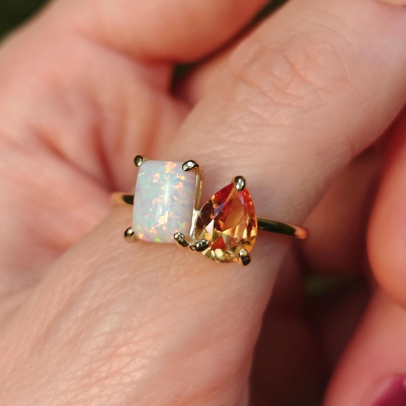 ring, aurora, toi et moi, custom, two stone, emerald cut and teardrop, genuine gemstone red garnet, purple amethyst, light blue aquamarine, clear quartz, opal, green emerald, multicolor alexandrite, rainbow topaz, pink ruby, light green peridot, blue sapphire, pink tourmaline, orange citrine, blue-purple tanzanite, sunstone, smokey quartz, onyx, moss agate, rutilated quartz, in silver yellow gold rose gold 14k solid gold