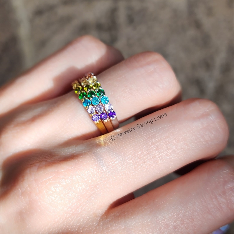 ring, eternity band, stacking ring, pink ruby, red and orange garnet, yellow citrine, light green peridot, green emerald, blue topaz, purple amethyst, round stones, silver, yellow gold, rose gold