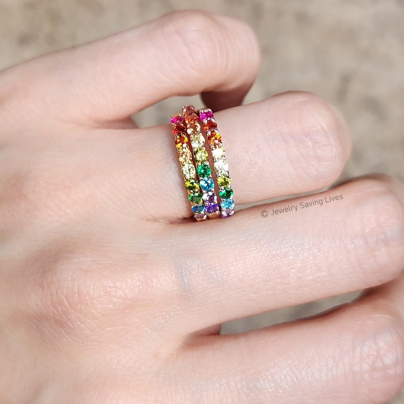 ring, eternity band, stacking ring, pink ruby, red and orange garnet, yellow citrine, light green peridot, green emerald, blue topaz, purple amethyst, round stones, silver, yellow gold, rose gold