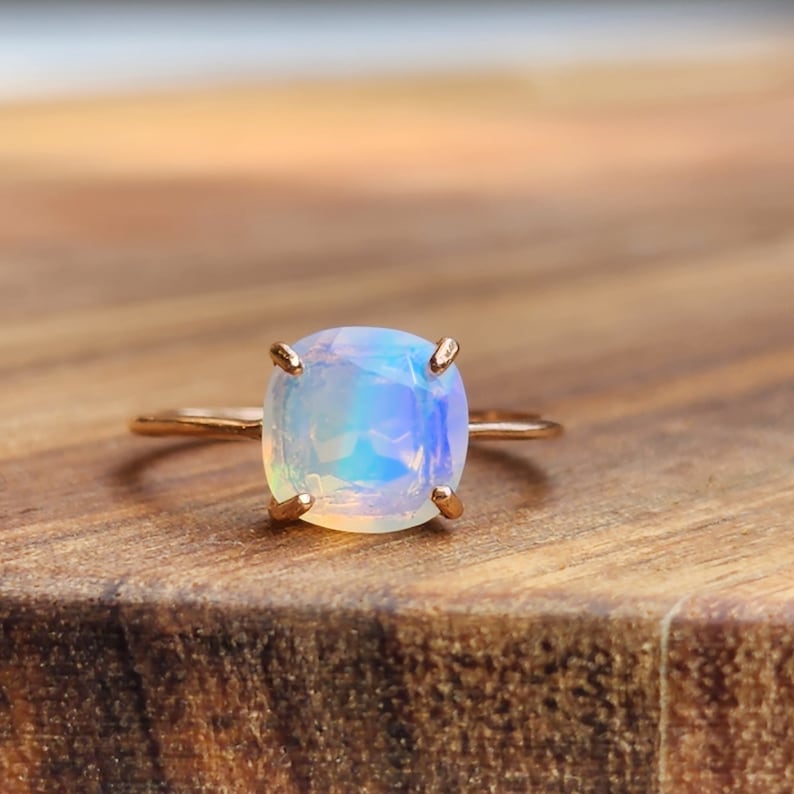 ring, rainbow iridescent fire welo opal, square stone, silver, yellow gold, rose gold