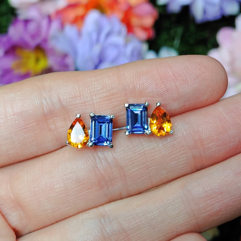 earring studs, aurora, toi et moi, custom, two stone, pushback earrings, emerald cut and teardrop, genuine gemstone red garnet, purple amethyst, light blue aquamarine, clear quartz, opal, green emerald, multicolor alexandrite, rainbow topaz, pink ruby, light green peridot, blue sapphire, pink tourmaline, orange citrine, blue-purple tanzanite, sunstone, smokey quartz, onyx, moss agate, rutilated quartz, in silver yellow gold rose gold 14k solid gold