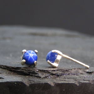 round sapphire earrings in silver